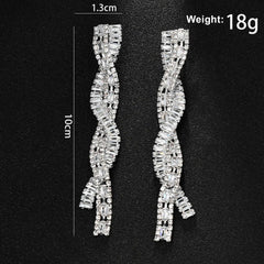 Silver Tone Twisted Baguette Crystal Drop Earrings