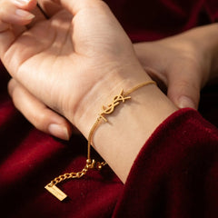 Gold Logo Charm Bracelet in Metal